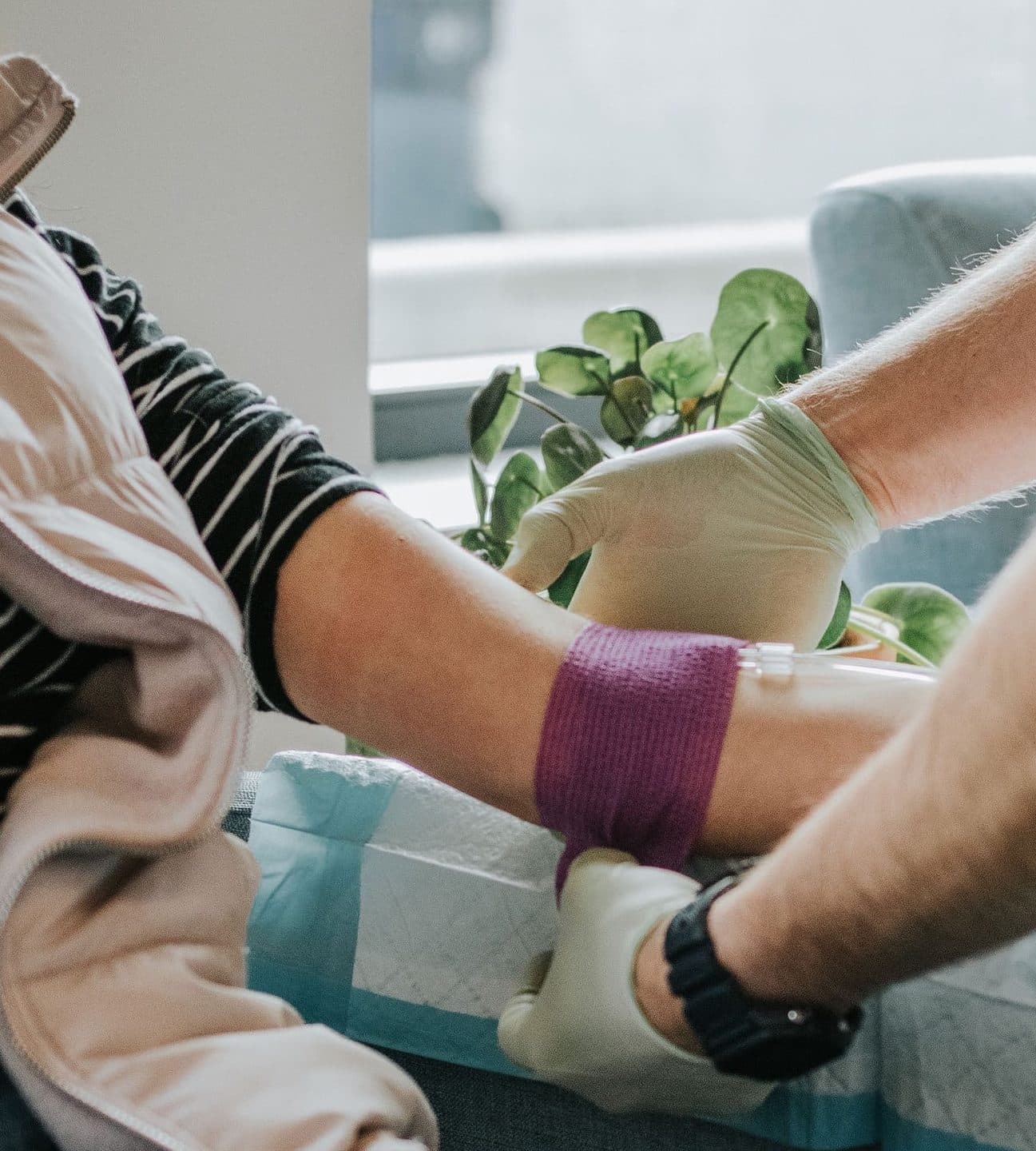 doctor giving a patient an IV