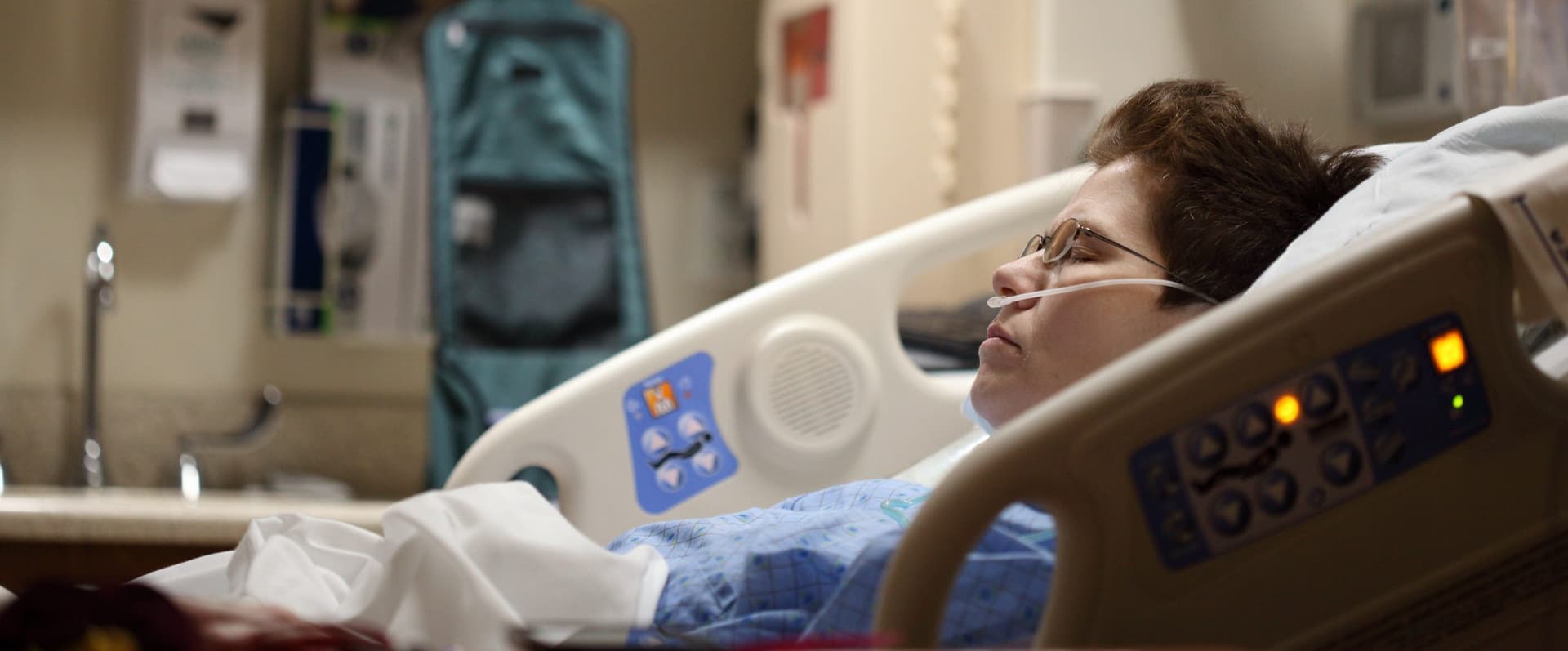 patient laying in hospital bed
