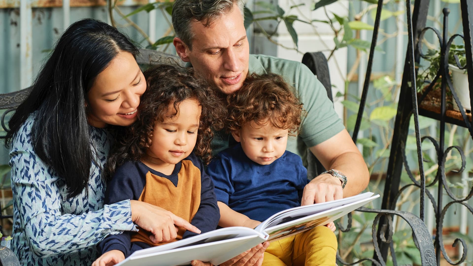 family reading a book