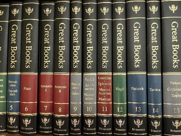 Row of spines of books in the Great Books series. Authors in the row include Plato, Aristotle, and Virgil.